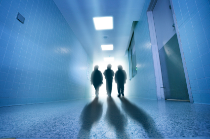 Shadows of people in a hospital hallway