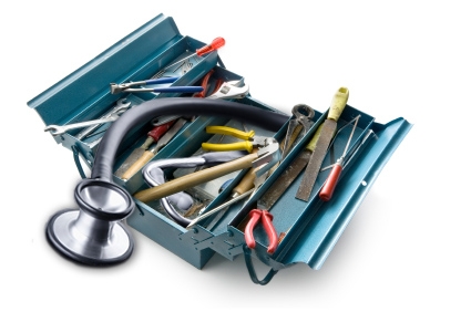Toolbox with tools and a stethoscope hanging out of it