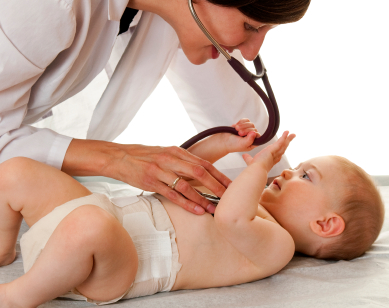 Doctor examines baby with stethoscope