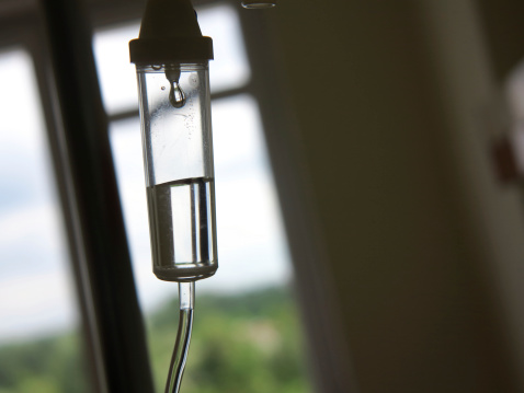 Infusion bottle with IV solution in hospital
