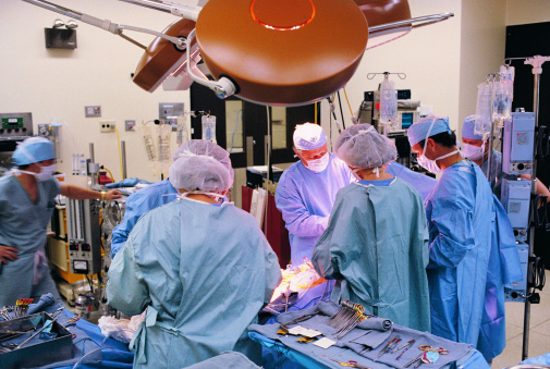 Surgeons at work in operating room