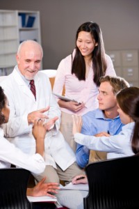 Professor having discussion with med students