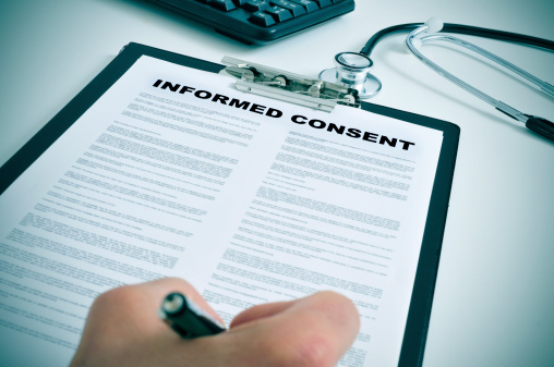 hand signing an informed consent document
