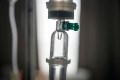 Close up IV saline solution drip for patient in hospital