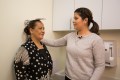 Woman getting height measured as part of Study of Latinos - Albert Einstein College of Medicine