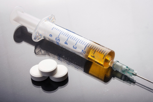 Drug syringe and heroin