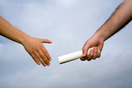 Handing baton from one person to another