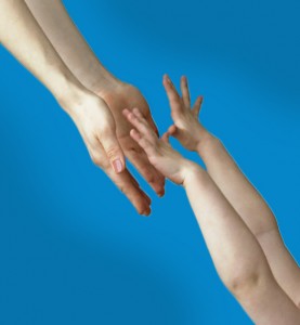Child's hands reaching up