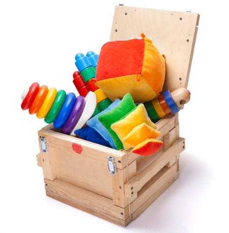 Wooden box overflowing with toys