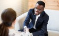 Young man greets his interviewer