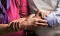 close up of elderly hands on each others forearms