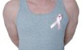 Torso of man in grey tank wearing breast cancer ribbon