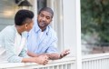 Black man talking to teen son
